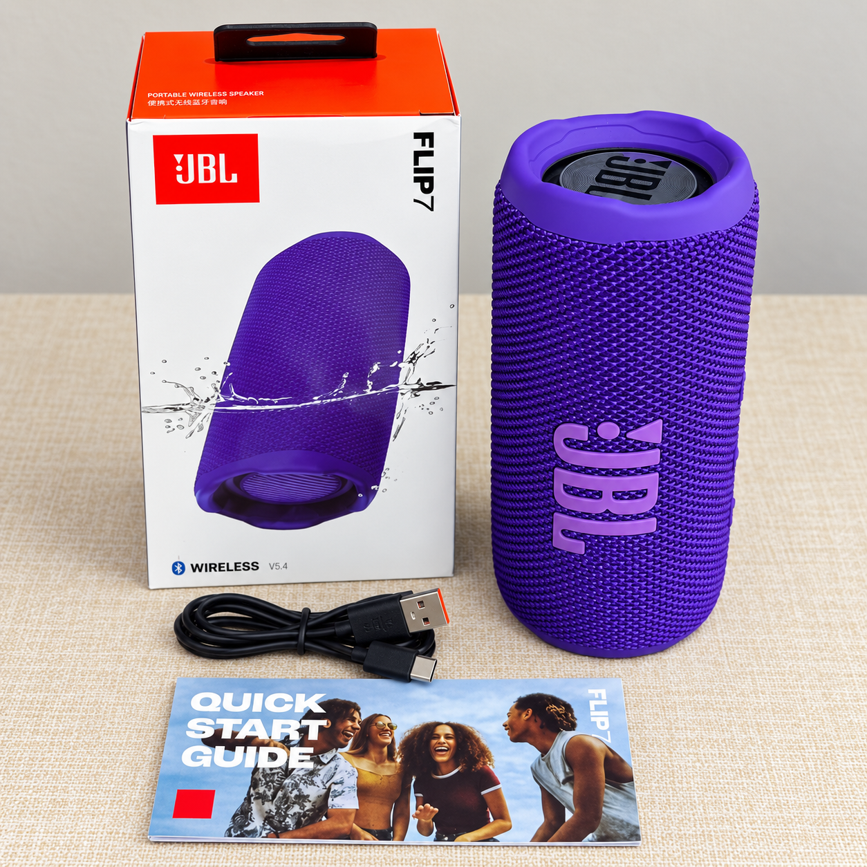 Altavoz púrpura FLIP7 con caja y accesorios